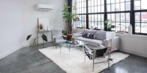 Modern living room with ductless mini-split AC on the wall