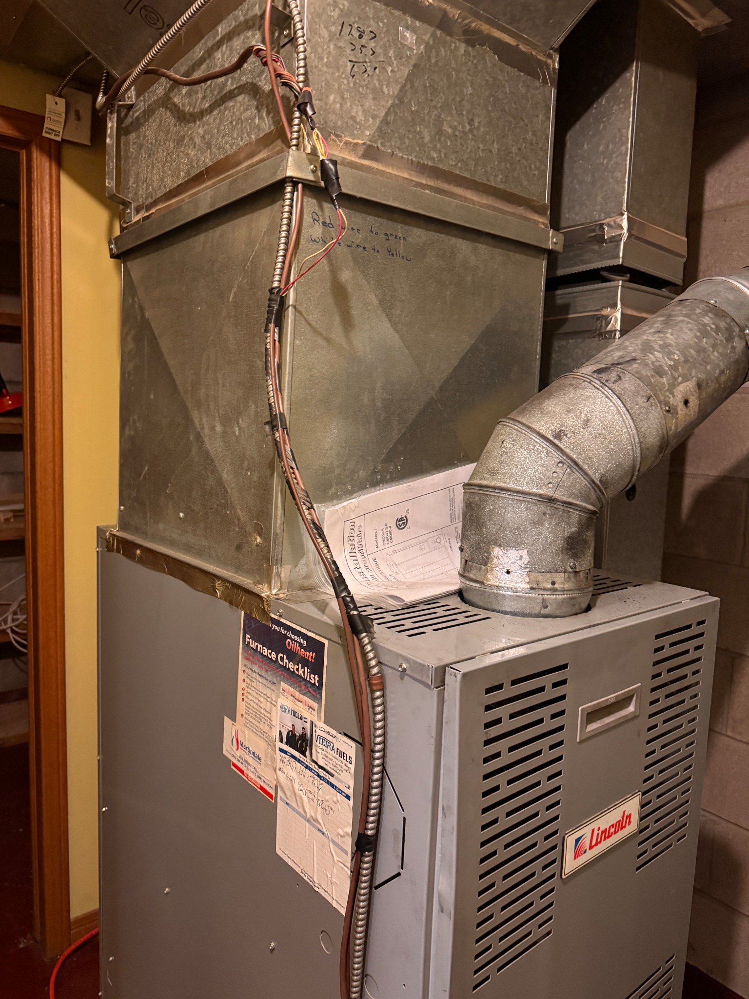Existing Lincoln oil furnace before cold climate heat pump retrofit